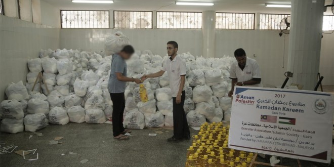 الجمعية الإسلامية توزع مساعدات عينية على 900 أسر فقيرة